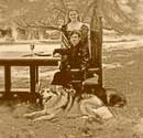 Artistic Photo 2 Eric Saperstein & Theresa Tonte posed with wolves Artisans of the Valley - Gothic Dining Table 2007 Photos by Henry Schweber